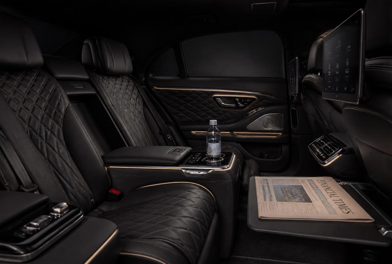 Rear cabin of a MATO chauffeur limousine with quilted leather seats